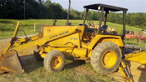 john deere 210c backhoe loader with skid steer implement mounting|jd 210c backhoe specs.